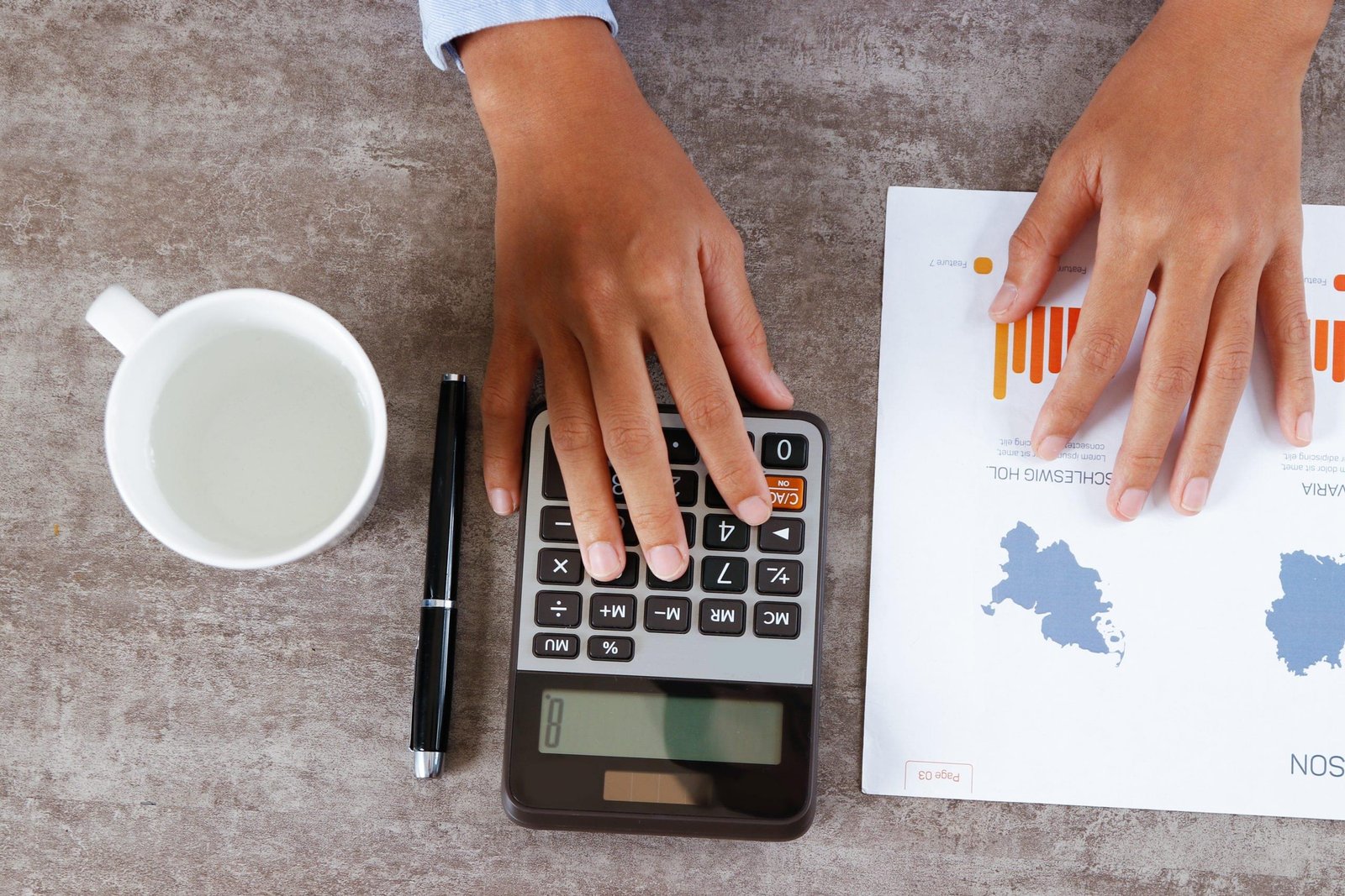 Closeup of manager computing on calculator. Person working with diagrams. Management concept. Cropped view.